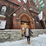 Christine in front of St. Peter's and St. Paul's Anglican Church in downtown Ottawa, Ontario