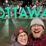 Harman and Christine in front of Ottawa sign